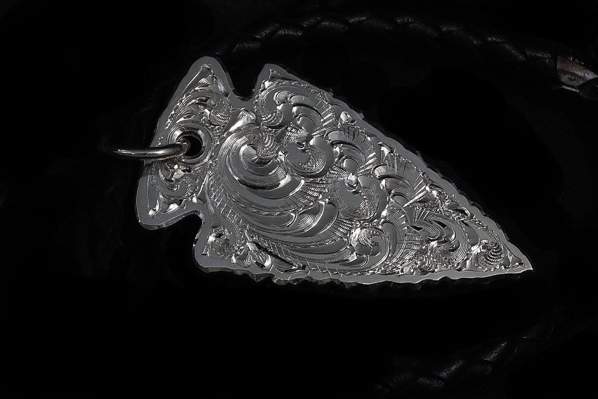 Decorative silver pendant with a leather neckpiece